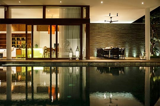 Pool and dining area at night